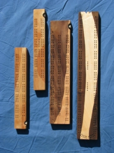 Small and large cribbage boards; Cherry, Maple and Walnut